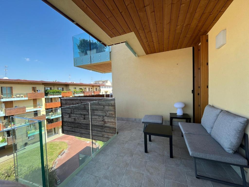 a balcony with a couch and a view of a building at [Portello] La casa di Andrea in Milan