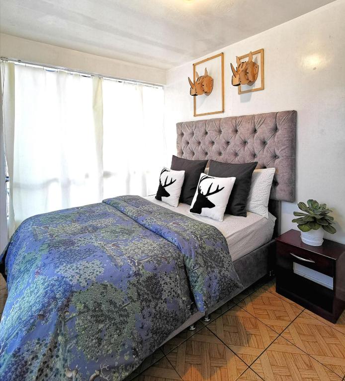 Postel nebo postele na pokoji v ubytování Cusco Kintu House