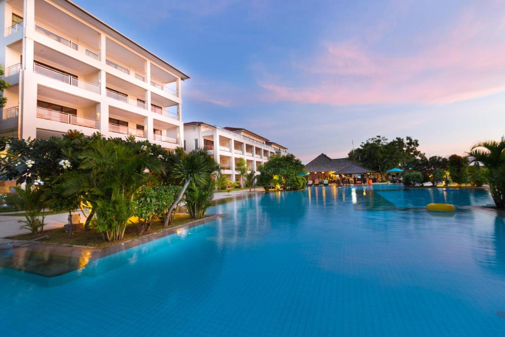 a large swimming pool in front of a building at Peninsula Bay Resort in Nusa Dua