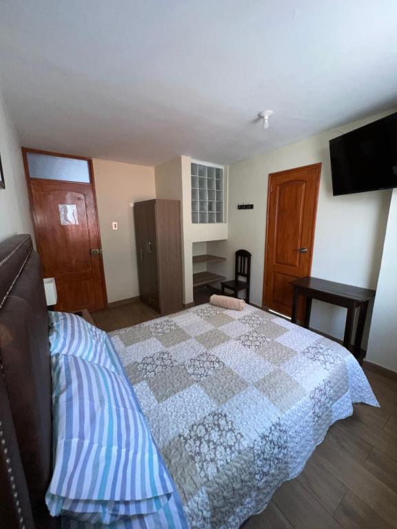 Postel nebo postele na pokoji v ubytování Antara Hostal