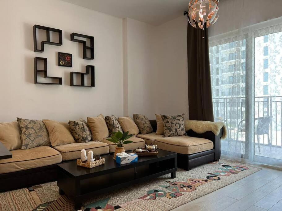 a living room with a couch and a coffee table at Best deal in town Yas Island 232WB10 in Abu Dhabi