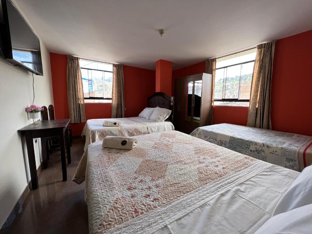 Postel nebo postele na pokoji v ubytování Antara Hostal