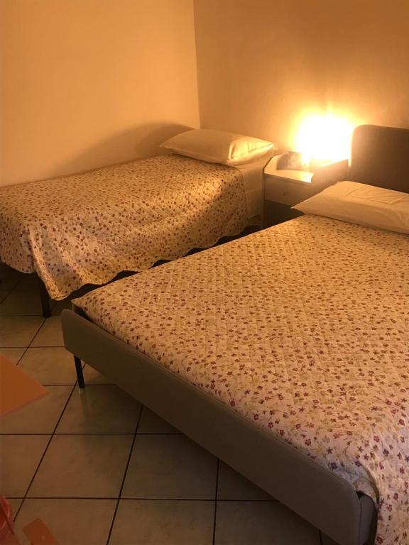 Łóżko lub łóżka w pokoju w obiekcie Bonsai - Bed & Breakfast