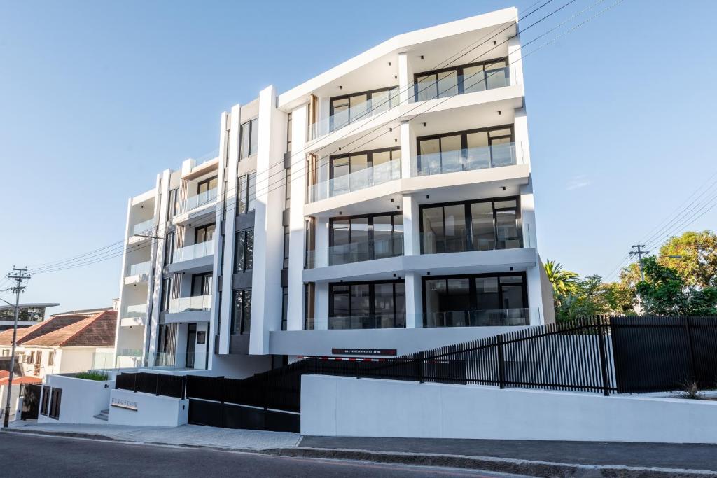 a white building on the side of a street at Casa on Kei Apple by Totalstay in Cape Town
