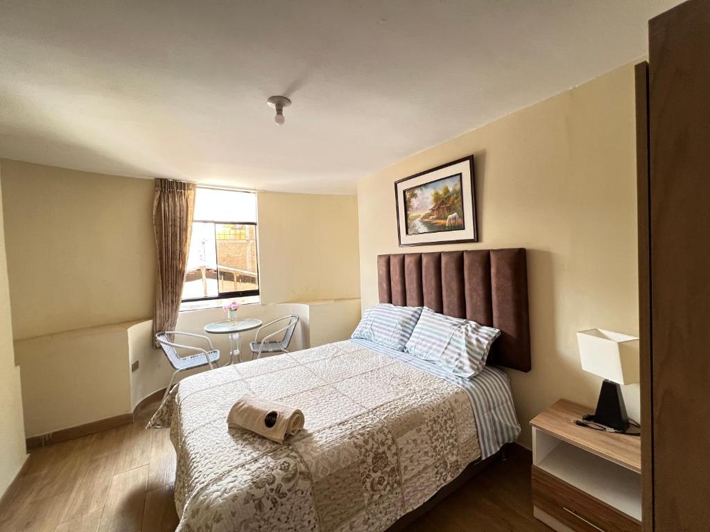 Postel nebo postele na pokoji v ubytování Antara Hostal
