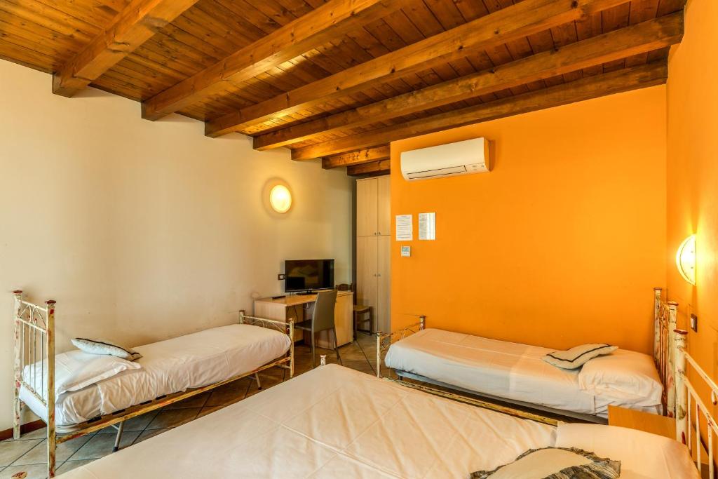 Postel nebo postele na pokoji v ubytování Agriturismo Pozzo Fiorito