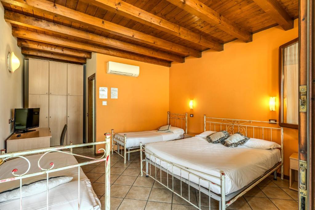 Postel nebo postele na pokoji v ubytování Agriturismo Pozzo Fiorito