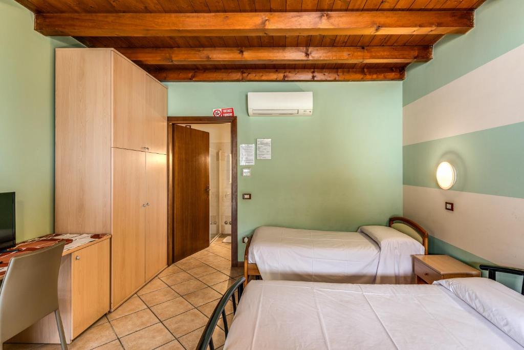 Postel nebo postele na pokoji v ubytování Agriturismo Pozzo Fiorito