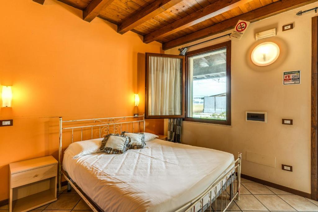 Postel nebo postele na pokoji v ubytování Agriturismo Pozzo Fiorito