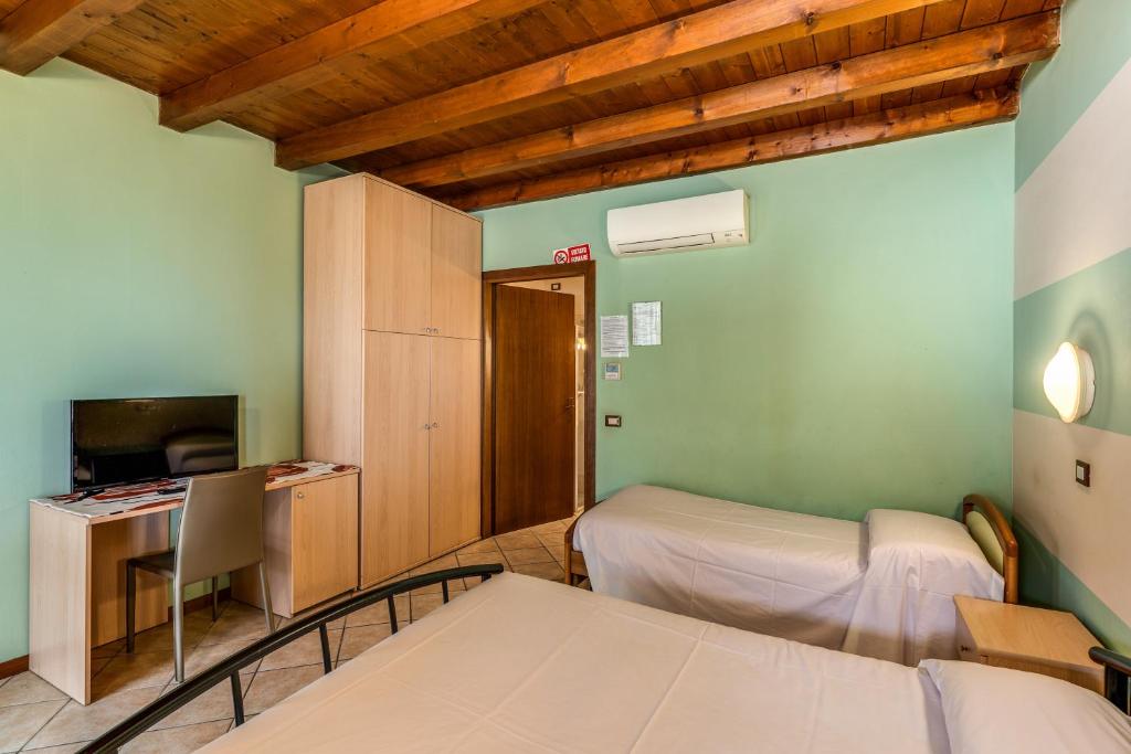 Postel nebo postele na pokoji v ubytování Agriturismo Pozzo Fiorito