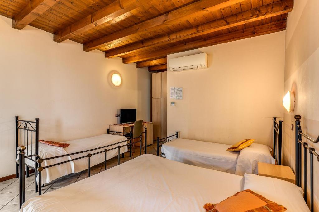 Postel nebo postele na pokoji v ubytování Agriturismo Pozzo Fiorito