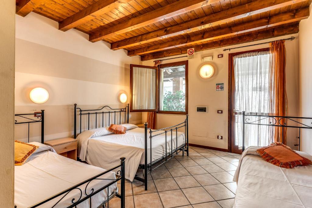 Postel nebo postele na pokoji v ubytování Agriturismo Pozzo Fiorito