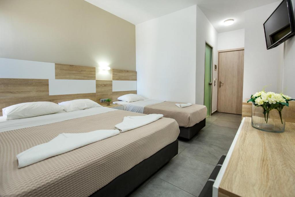 Postel nebo postele na pokoji v ubytování Astris Sun Hotel