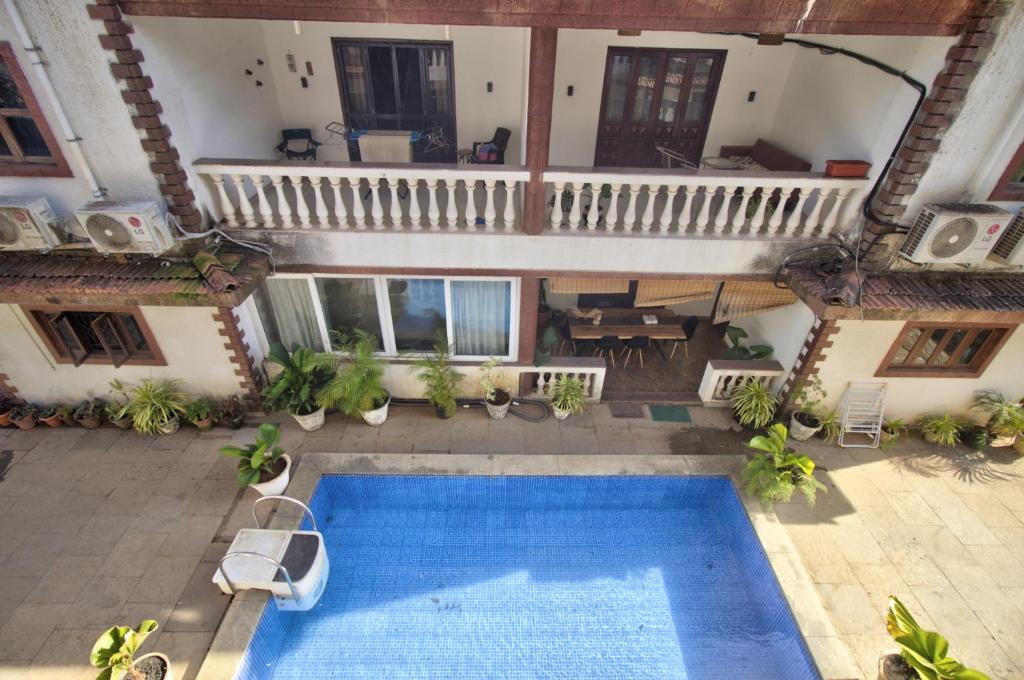 an overhead view of a swimming pool in a building at RONNE'S VILLA De SOL-3BHK LUXURY VILLA In Assagaon in Mapusa