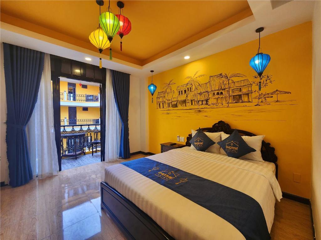 Letto o letti in una camera di iHome Hoi An