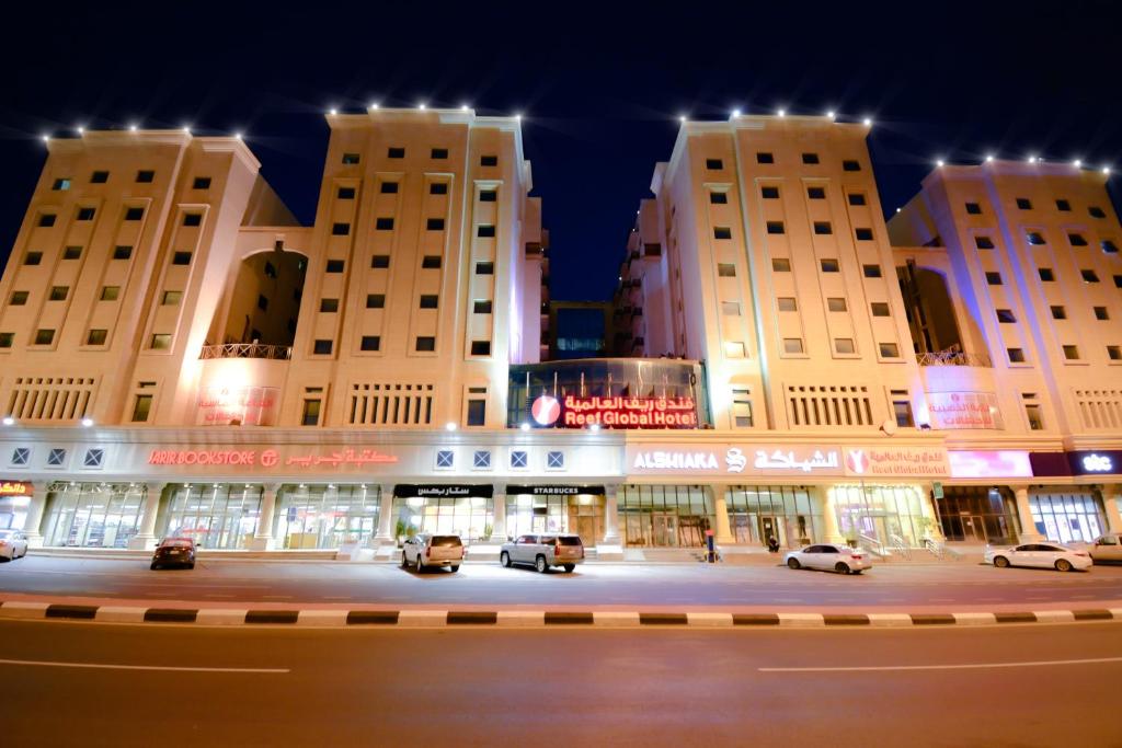 a view of a shopping center at night at Reef Global Hotel in Makkah