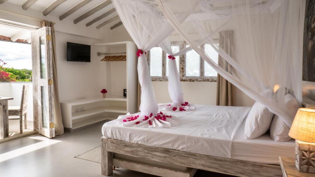 Postel nebo postele na pokoji v ubytování Casamia Suites