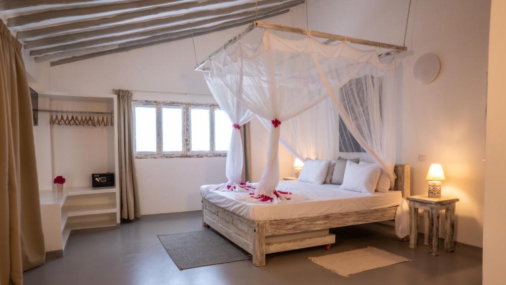 Postel nebo postele na pokoji v ubytování Casamia Suites
