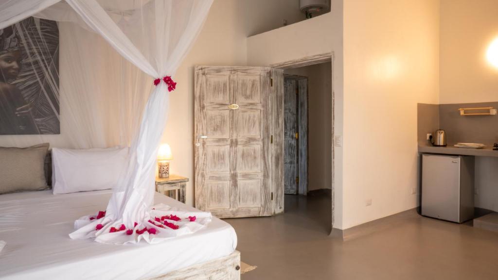 Postel nebo postele na pokoji v ubytování Casamia Suites