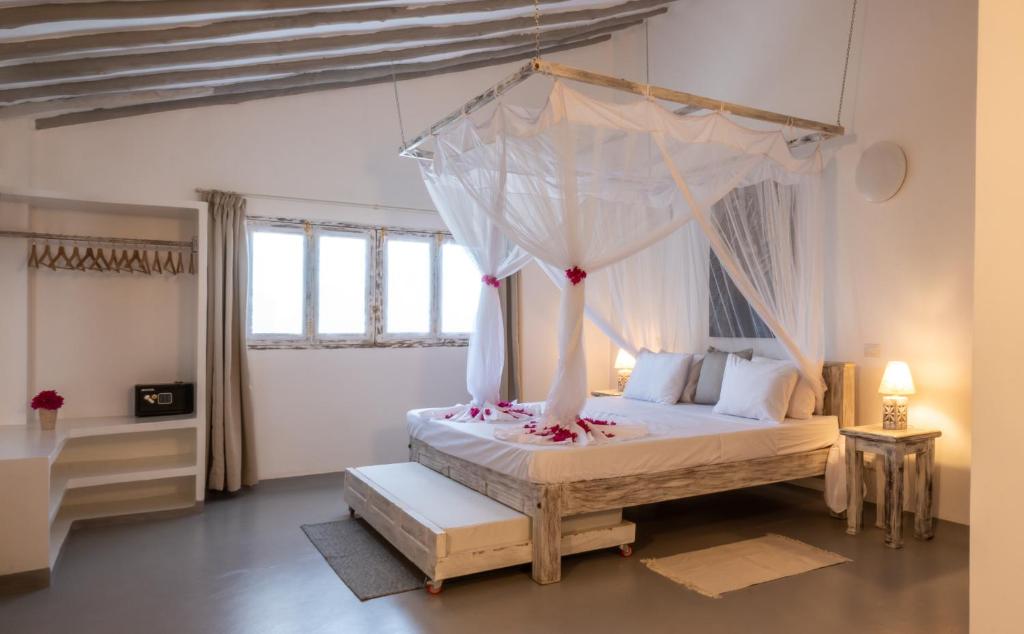 Postel nebo postele na pokoji v ubytování Casamia Suites