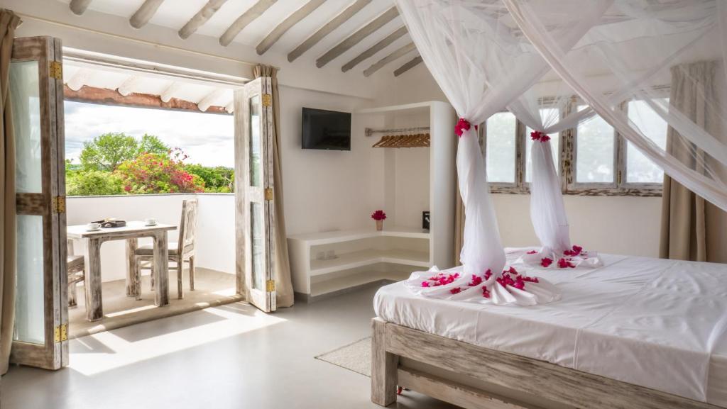 Postel nebo postele na pokoji v ubytování Casamia Suites