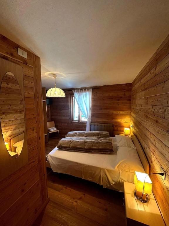 Postel nebo postele na pokoji v ubytování Sasso Nero