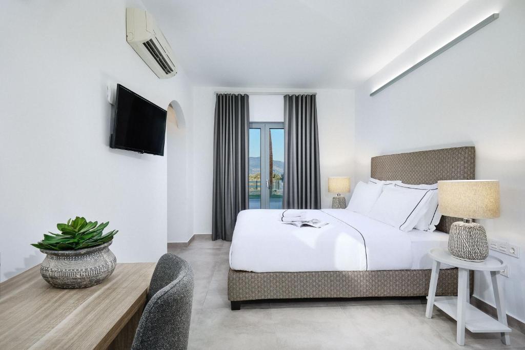 Postel nebo postele na pokoji v ubytování Quattro Suites