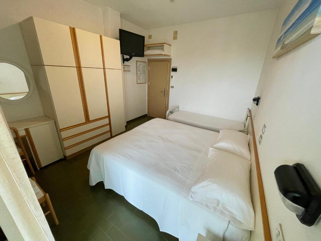 Postel nebo postele na pokoji v ubytování Hotel Pari
