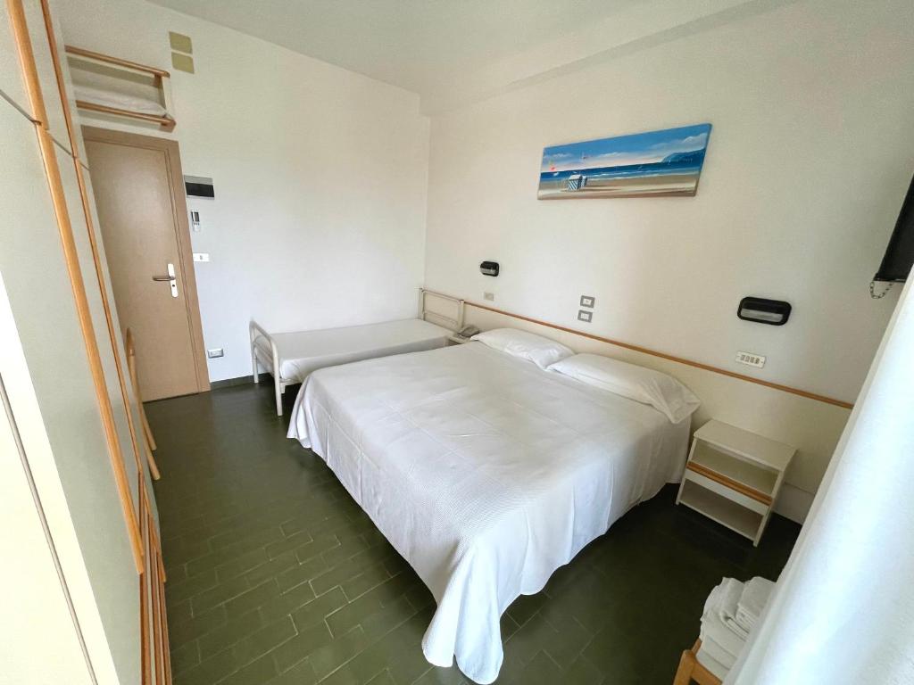 Postel nebo postele na pokoji v ubytování Hotel Pari