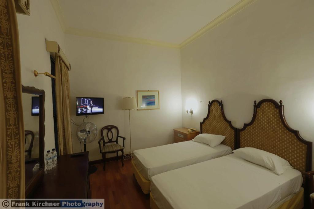 Postel nebo postele na pokoji v ubytování Hotel Castille