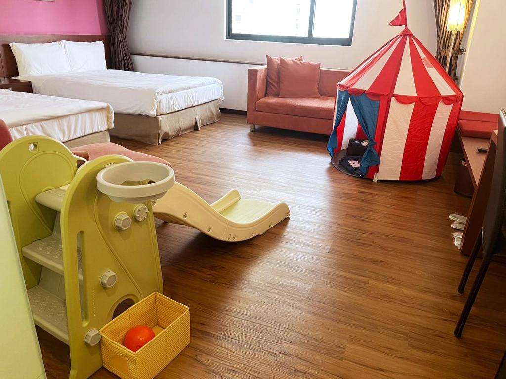 Postel nebo postele na pokoji v ubytování Hotel Leisure Tamsui