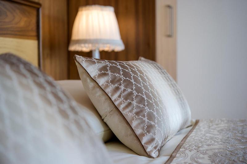 Postel nebo postele na pokoji v ubytování Grand Hotel Donat Superior & Wellness Center