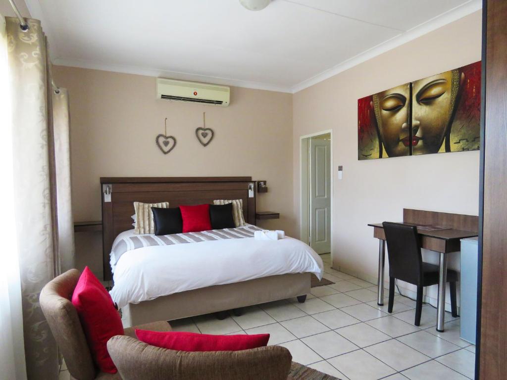 Postel nebo postele na pokoji v ubytování Andante Guesthouse Klerksdorp