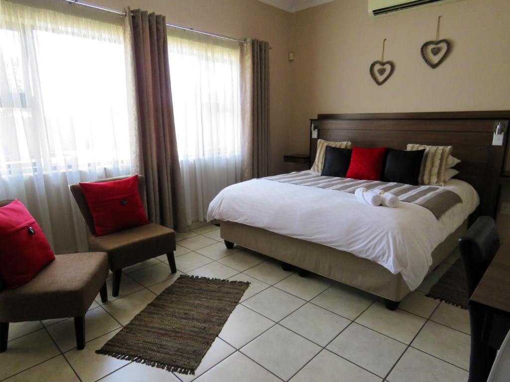 Postel nebo postele na pokoji v ubytování Andante Guesthouse Klerksdorp