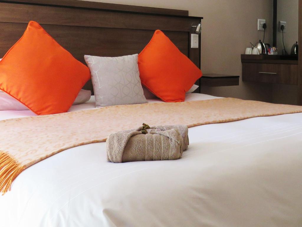 Postel nebo postele na pokoji v ubytování Andante Guesthouse Klerksdorp