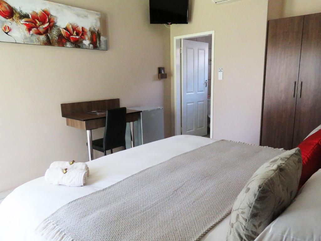 Postel nebo postele na pokoji v ubytování Andante Guesthouse Klerksdorp