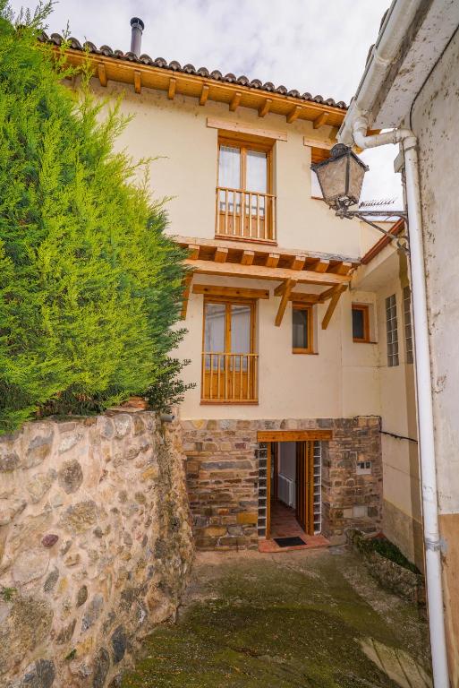 an image of a house with a stone wall at Casa Arnedillo by Apartamentos Arnedillo in Arnedillo