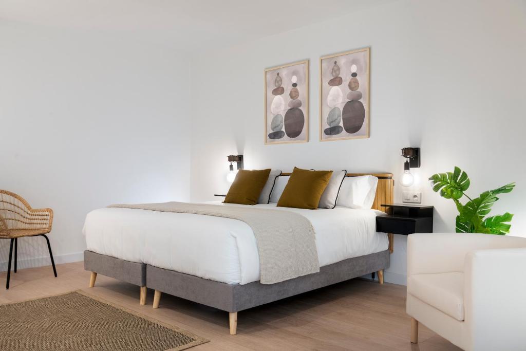 Posteľ alebo postele v izbe v ubytovaní Magno Apartments Castelar