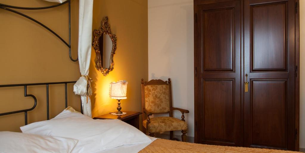 Postel nebo postele na pokoji v ubytování Al Borgo Rooms