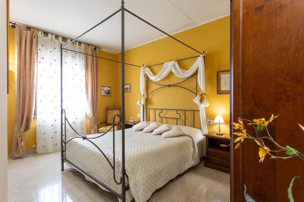 Postel nebo postele na pokoji v ubytování Al Borgo Rooms