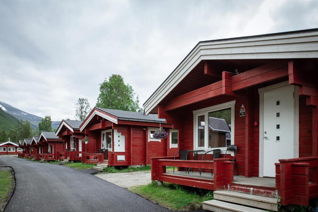 a row of red houses on a street at Tromsø Lodge & Camping in Tromsø