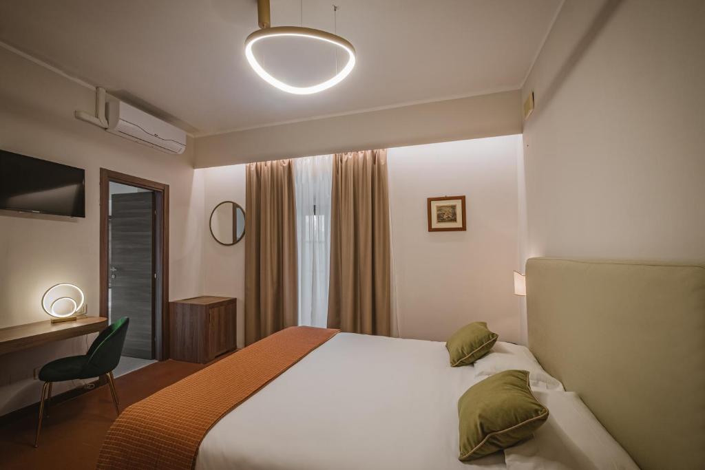 Postel nebo postele na pokoji v ubytování Hotel Villa Montegranelli