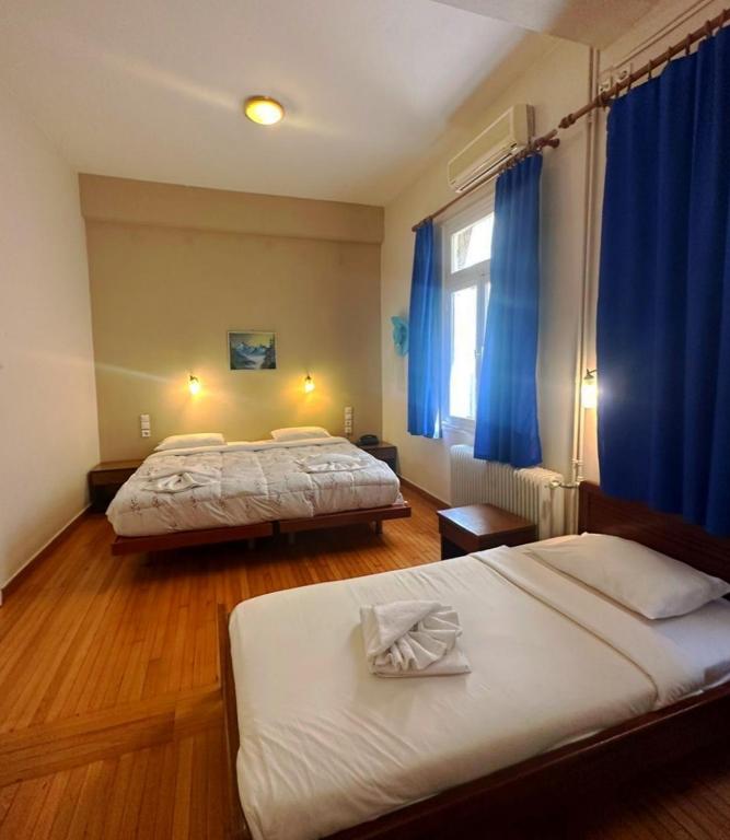 Postel nebo postele na pokoji v ubytování Vassilikon Hotel