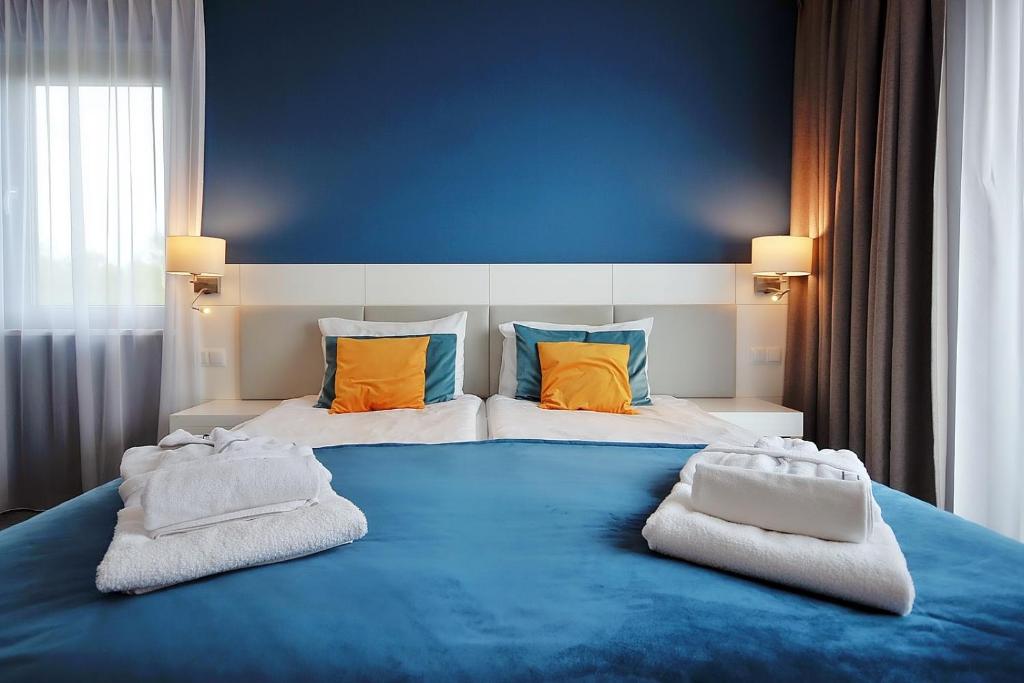 Una cama o camas en una habitación de Hotel Hel