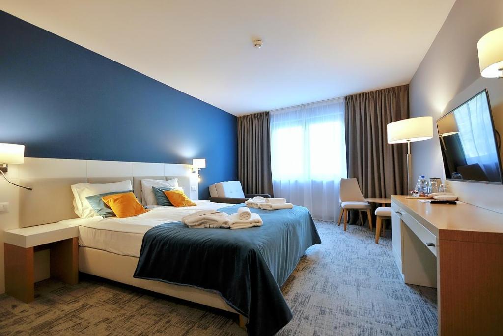 Una cama o camas en una habitación de Hotel Hel