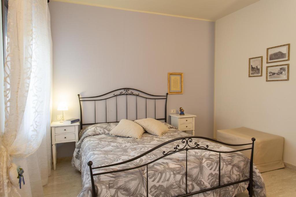 Postel nebo postele na pokoji v ubytování Al Borgo Rooms