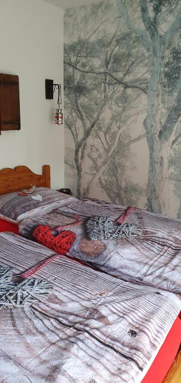 Postel nebo postele na pokoji v ubytování L'Aurosée
