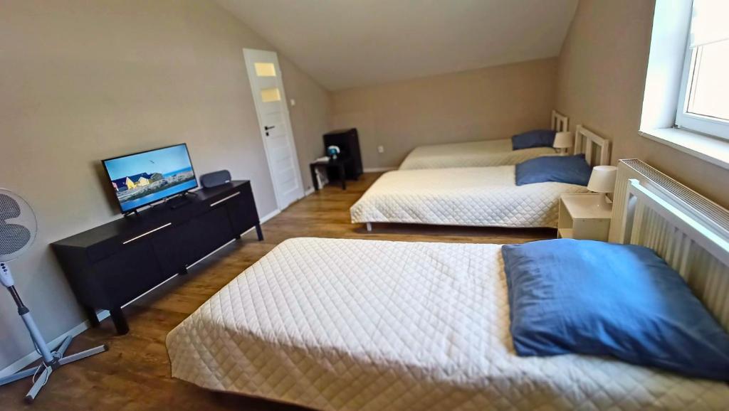 Postel nebo postele na pokoji v ubytování Smart Stay Hostel Gdynia
