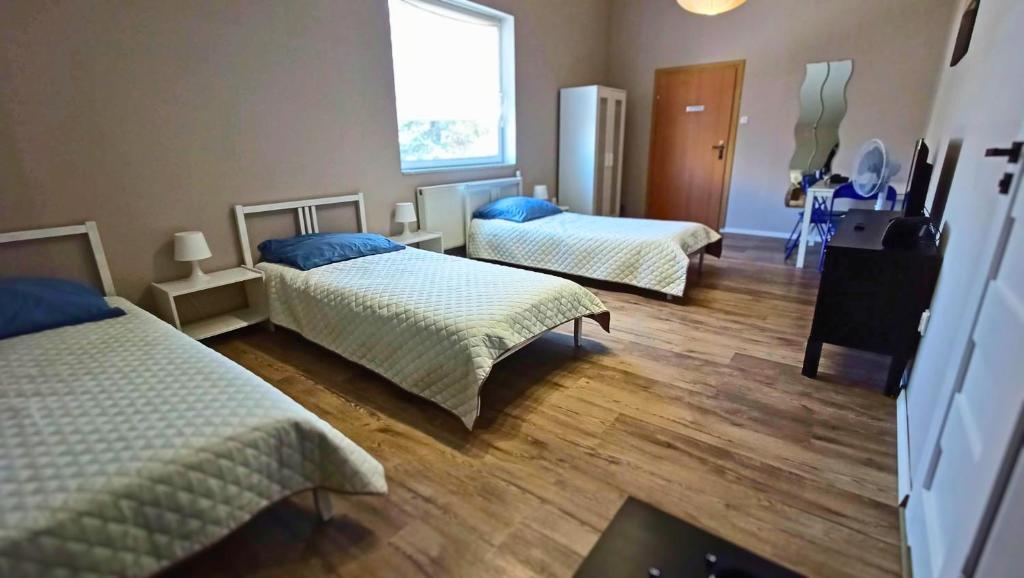 Postel nebo postele na pokoji v ubytování Smart Stay Hostel Gdynia