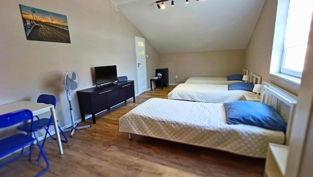 Postel nebo postele na pokoji v ubytování Smart Stay Hostel Gdynia